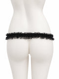 Black lace support strap shown from the rear on a display mannequin